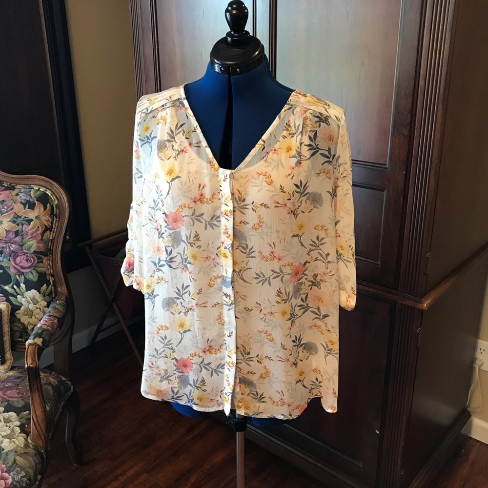 Sheer floral print blouse.